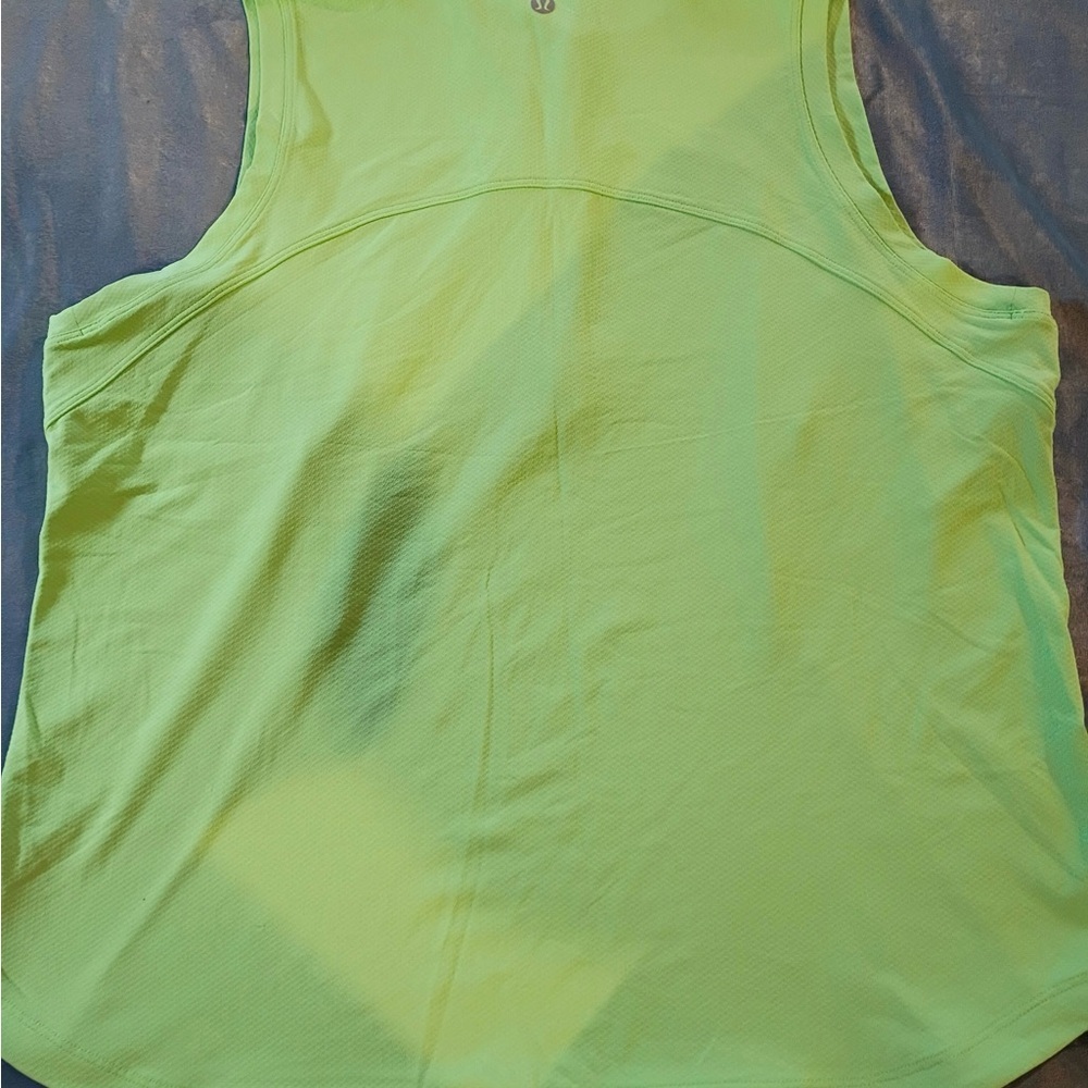 Bright neon green Lululemon sleeveless athletic top with half zip front. - Picture 5 of 7